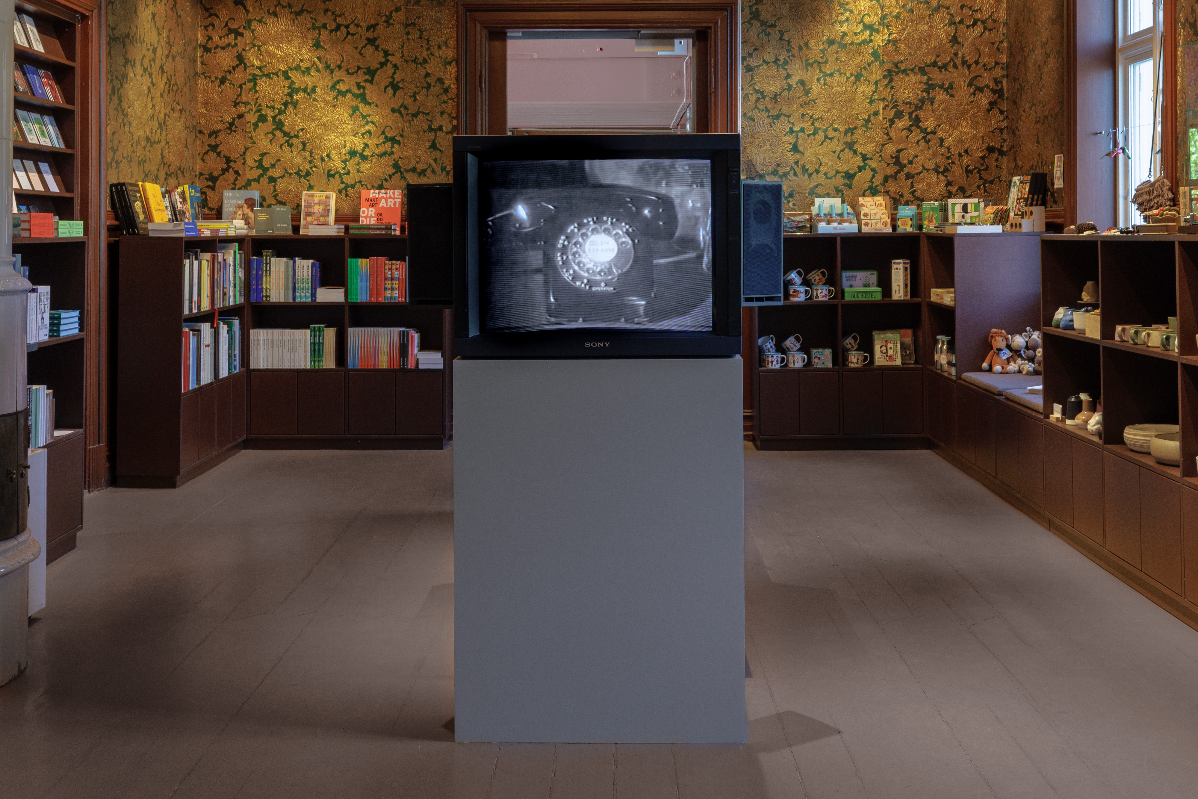 The video work Telephones (1995) by artist and composer Christian Marclay greets visitors in the gift shop. 